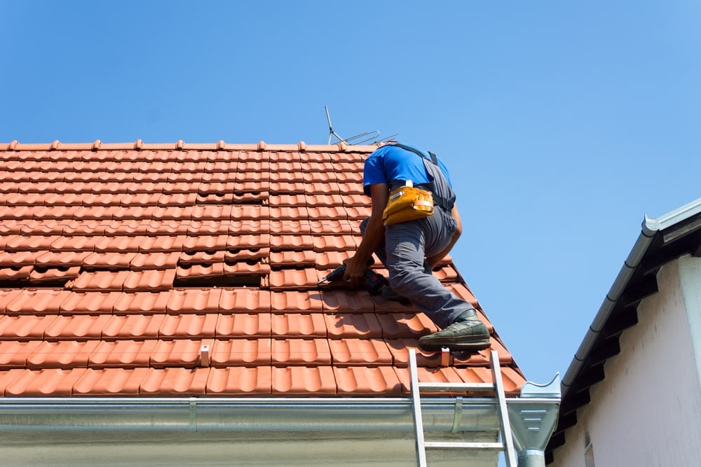 home inspector conducting a wind mitigation inspection